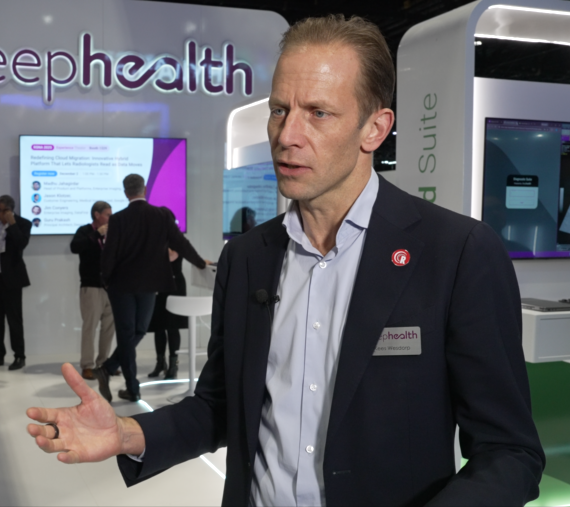 Man in a suit talking at an event - Kees Wesdorp, DeepHealth CEO...